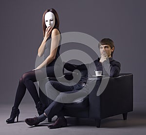 Arrogant man and masked woman