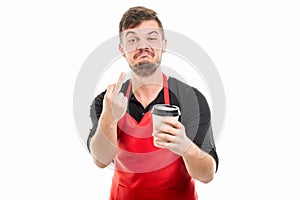 Arrogant supermarket employer showing obscene gesture holding co photo