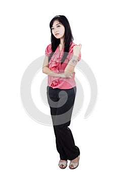 Arrogant woman standing in studio