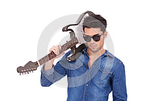 Arrogant young man with guitar