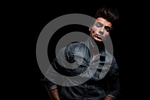 Arrogant young man in jeans jacket