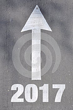 Arrow on asphalt road written word 2016 .