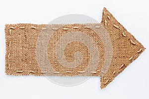 Arrow of burlap lies on a white background