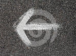 White arrow painted on the road