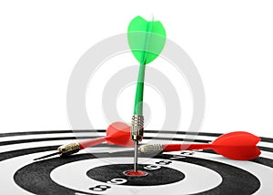 Arrow hitting target on dart board against white