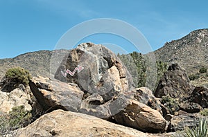 Arrow points to the desert rock murals photo