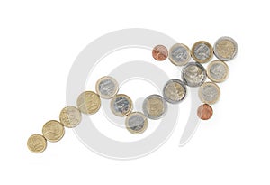 Arrow made out of euro coins isolated on a white b