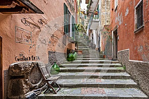 The arrow passage with steps in ancient village of Monterosso al Mare in Cinque Terre coastal area. Liguria region in Italy