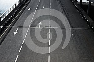 Arrow on road Indicative arrows on an asphalt road close up