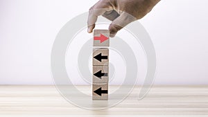 The arrow shows the direction on the wooden block for Stand out-think different