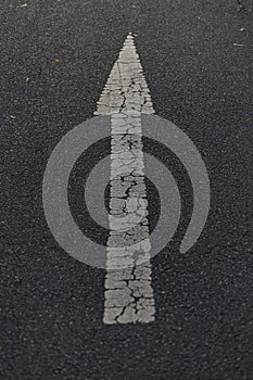 An arrow sigh on asphalt