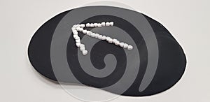 An arrow sign on black computer mouse pad