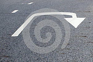 Arrow signs as road markings on a street