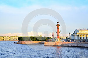 Arrow of Vasilevsky island and Rostral columns at sunset