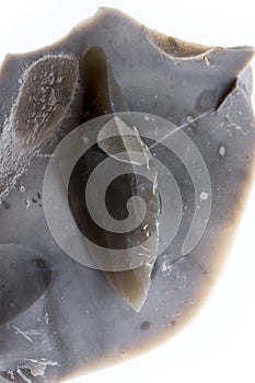 An arrowhead made from flintstone close up photo