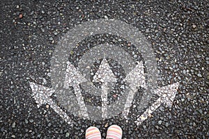 arrows on asphalt floor with 5 decisions