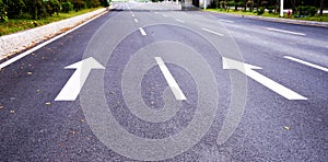 Arrows on the asphalt to indicate the direction of driving