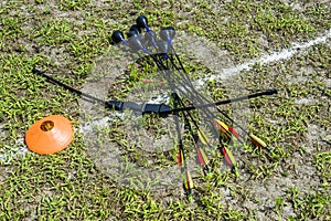 Arrows and a bow for archery tag on the grass