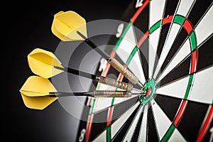 Dartboard with arrows on ackground photo