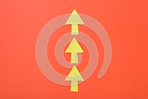 Arrows only forward. Three arrows in one direction. Orange background and bright yellow arrows.