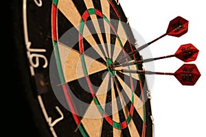 Arrows hitting dartboard - isolated