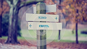 Arrows pointing two opposite directions towards Kind and Cruel