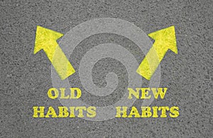 Arrows with two opposite directions to Old and New Habits on asphalt, top view