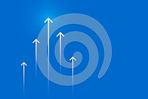 Arrows up on blue background, copy space composition, business growth concept.