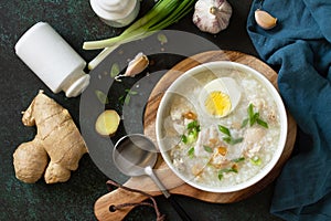 Arroz Caldo Soup. Hot soup with ginger chicken rice and garlic. photo