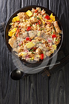 Arroz Chaufa is Peruvian Chinese fried rice consists of rice, red bell peppers, onions, garlic, soy sauce, scrambled eggs and photo