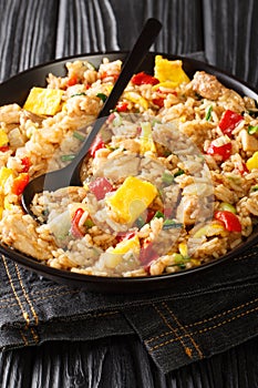 Arroz Chaufa is Peruvian Chinese fried rice consists of rice, red bell peppers, onions, garlic, soy sauce, scrambled eggs and photo