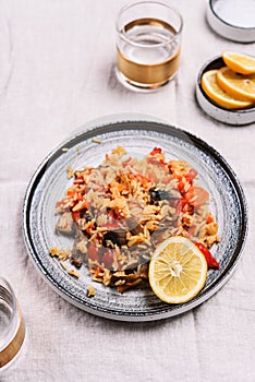 Arroz con verduras y azafran, spanish dish. Vegetarian risotto with vegetables, champignons and saffron photo