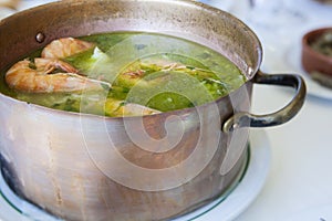 Arroz de Tamboril or soupy seafood rice, portuguese recipe photo