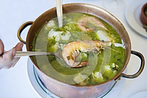 Arroz de Tamboril or soupy seafood rice, portuguese recipe photo