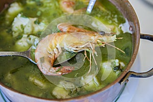 Arroz de Tamboril or soupy seafood rice, portuguese recipe photo