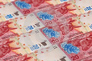 ARS. Closeup Argentine peso banknotes background photo