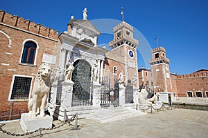 Arsenale di Venezia walls and white statues in Venice, Italy