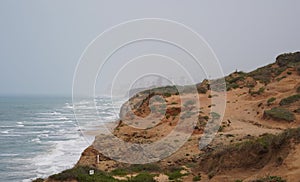 Arsuf cliff, a kurkar sandstone cliff nature reserve, high above the Mediterranean sea coastline.