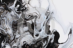 Art Abstract flow pour acrylic, ink and watercolor marble painting. Black and white color wave texture blots background