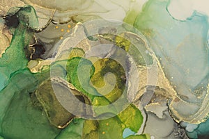Art Abstract  watercolor flow blot painting. Color canvas marble texture background. Gold and green Alcohol ink