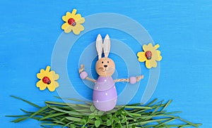 Art baby Easter bunny on spring green grass