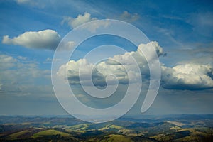 Art beautiful mountain panorama with blue sky and sunny valley