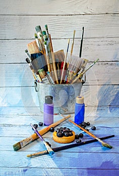 Blueberry cake with paint and brushes
