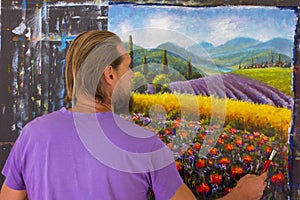 Art creative process. Artist create painting Italian summer countryside. Tuscany. Field of red poppies, a field of yellow rye. Rur