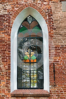 Art-deco church window. View through to the window on the other side.