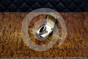 Art deco ring on an antique table luxury jewellery stillife