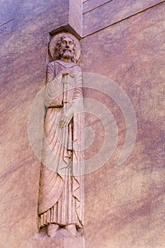 Art deco statue of Catholic Evangelist holding a large book