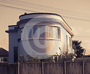 art deco style building home house round curved windows property period era architecture