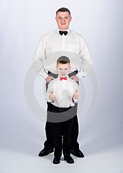 Art director. father and son in formal suit. little boy with dad businessman. family day. esthete. male fashion. happy