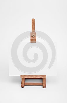 Art easel with white card.